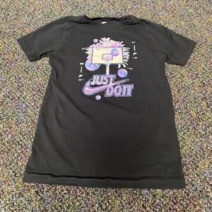 Girls Nike Black Tee with Iridescent Purple Graphic. Size M